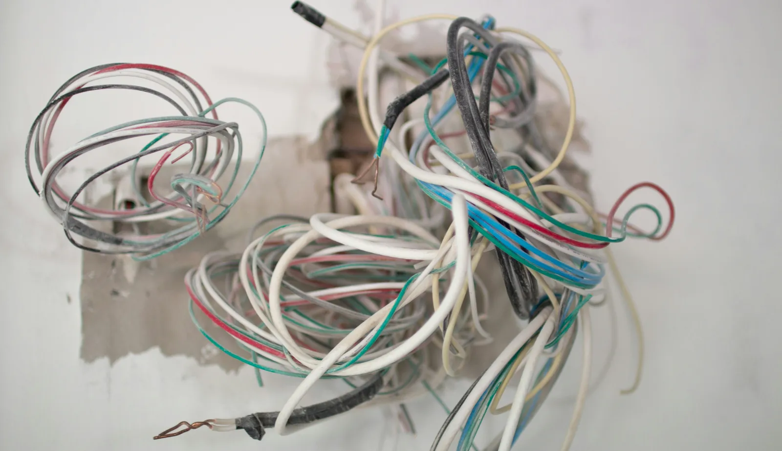 Outdated home electrical signs showing exposed wiring needing electrical rewiring