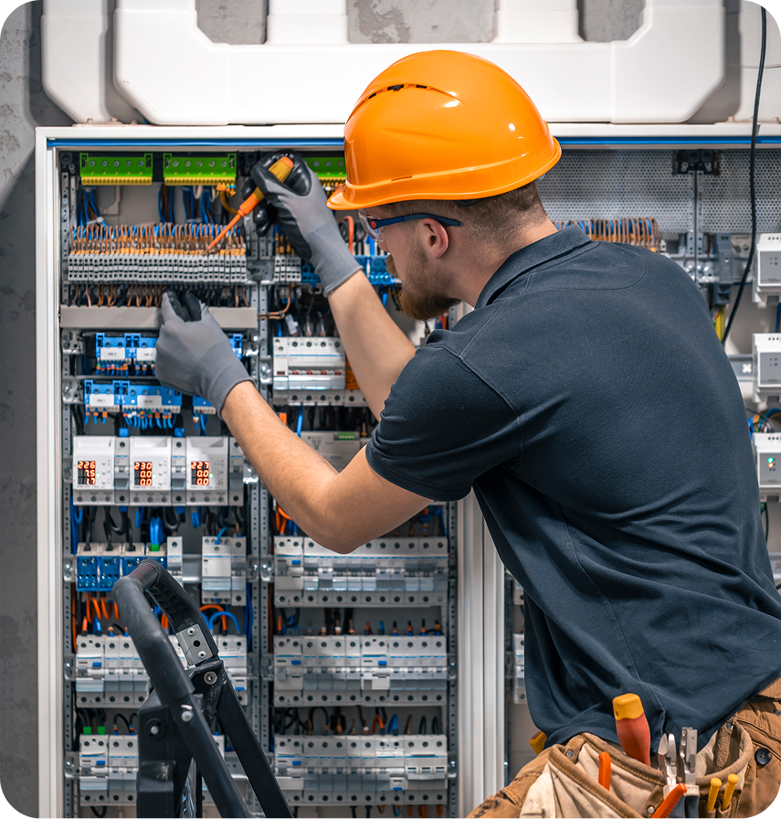 Rectangle-10 Electrician repairing wiring inside an electrical panel