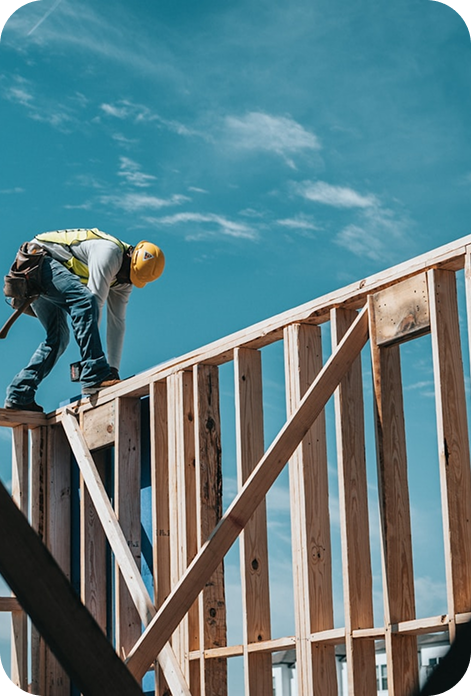Professional general contractor measuring wood for a home renovation project in Denver, Colorado.
